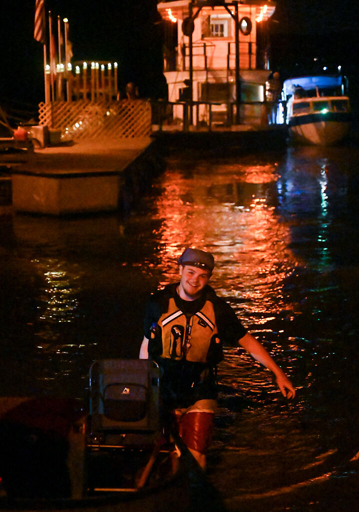 Matthew Hall takes a boat out of the water
